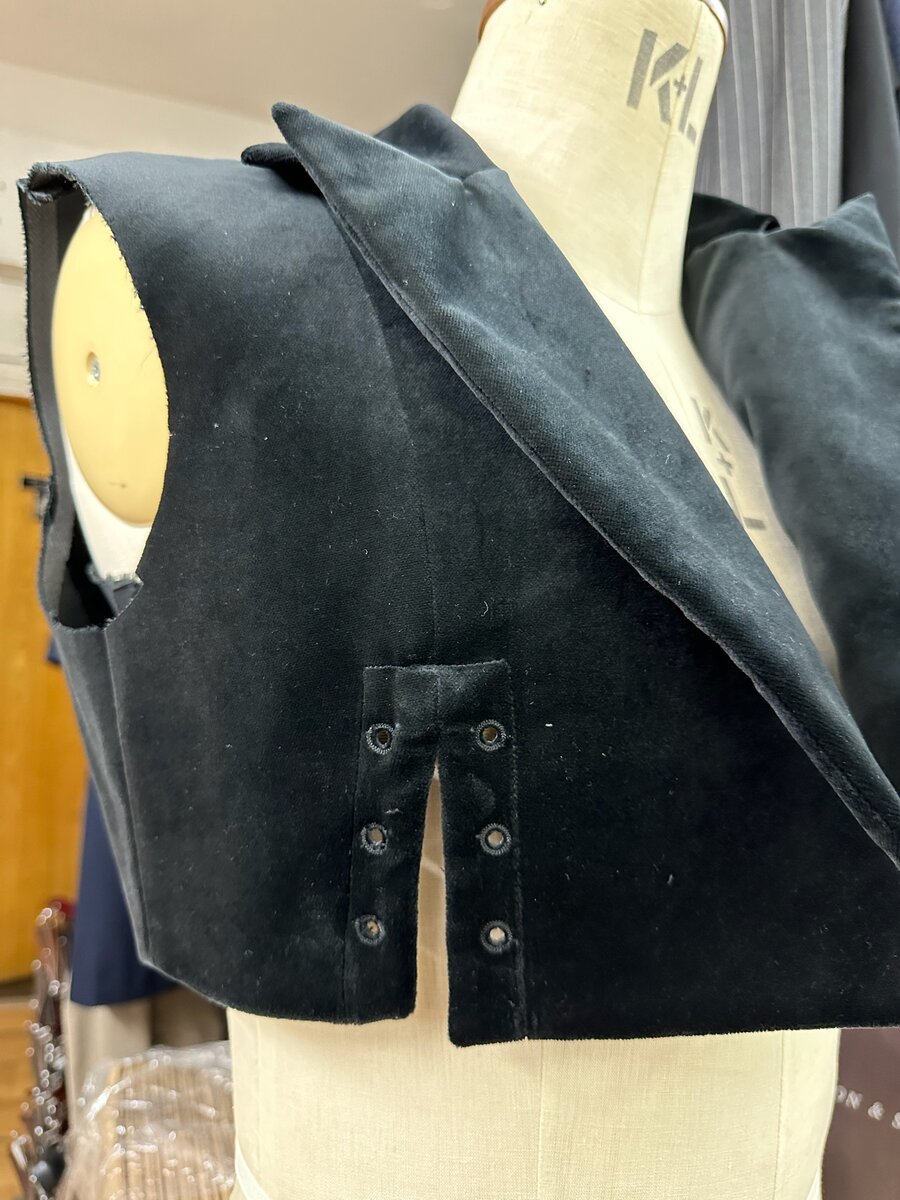 Bespoke jacket on a mannequin in the workshop